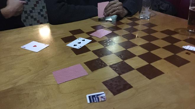 Running into a Skull at a bar, using a deck of cards. (We used red cards for flowers, and black for skulls)